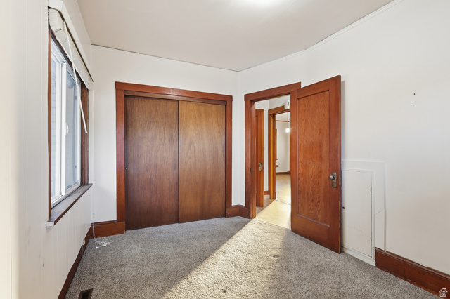 202 Main Street Smithfield, UT 84335 - Photo 20 of 32 Carpeted bedroom featuring a closet and baseboards