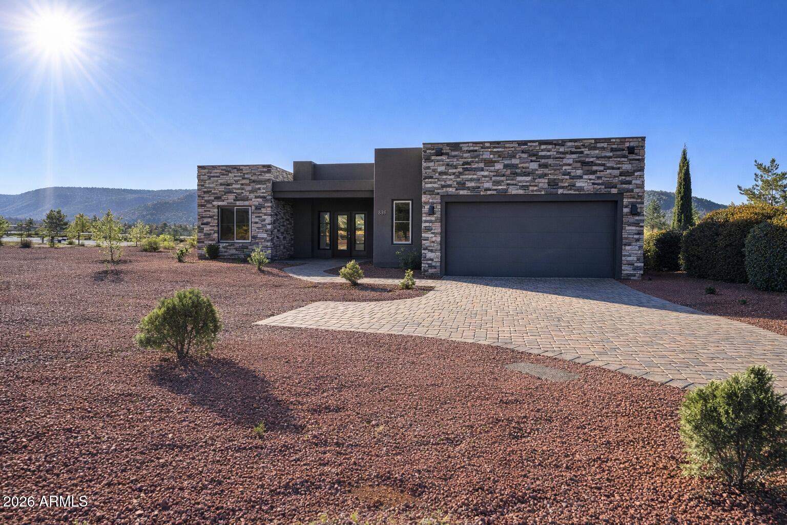 125 Starlight Way Sedona, AZ 86351 - Photo 2 of 11 a view of a livingroom with furniture and a fireplace