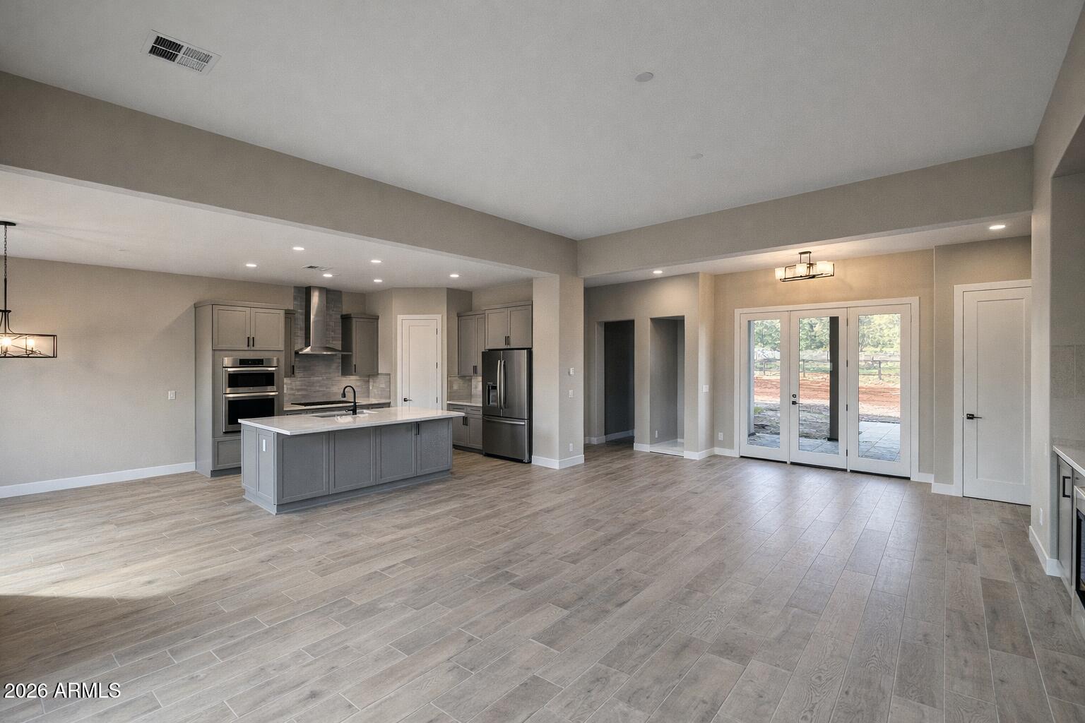 125 Starlight Way Sedona, AZ 86351 - Photo 7 of 11 a large space with a large window and wooden floor