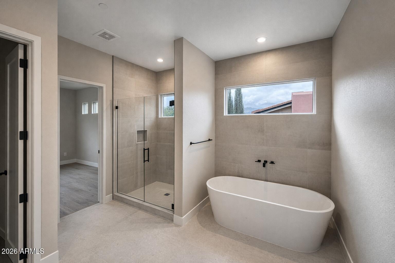 125 Starlight Way Sedona, AZ 86351 - Photo 10 of 11 a bathroom with a bathtub and shower