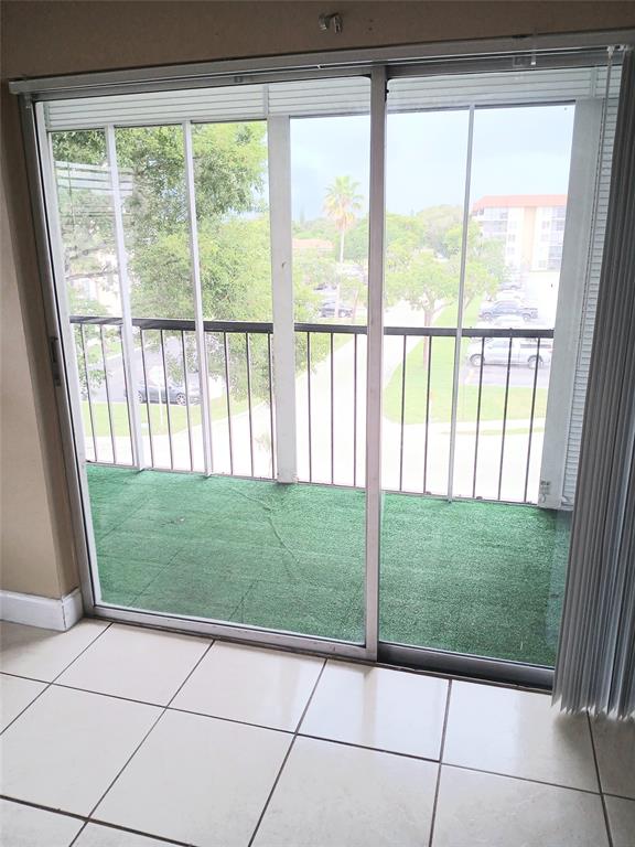 4170 Inverrary Drive, Unit 412 Lauderhill, FL 33319 - Photo 12 of 15 a living room view with a outdoor space