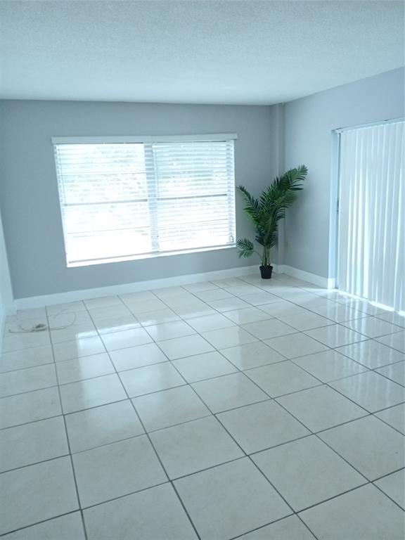 4170 Inverrary Drive, Unit 412 Lauderhill, FL 33319 - Photo 6 of 15 a view of an empty room with a window