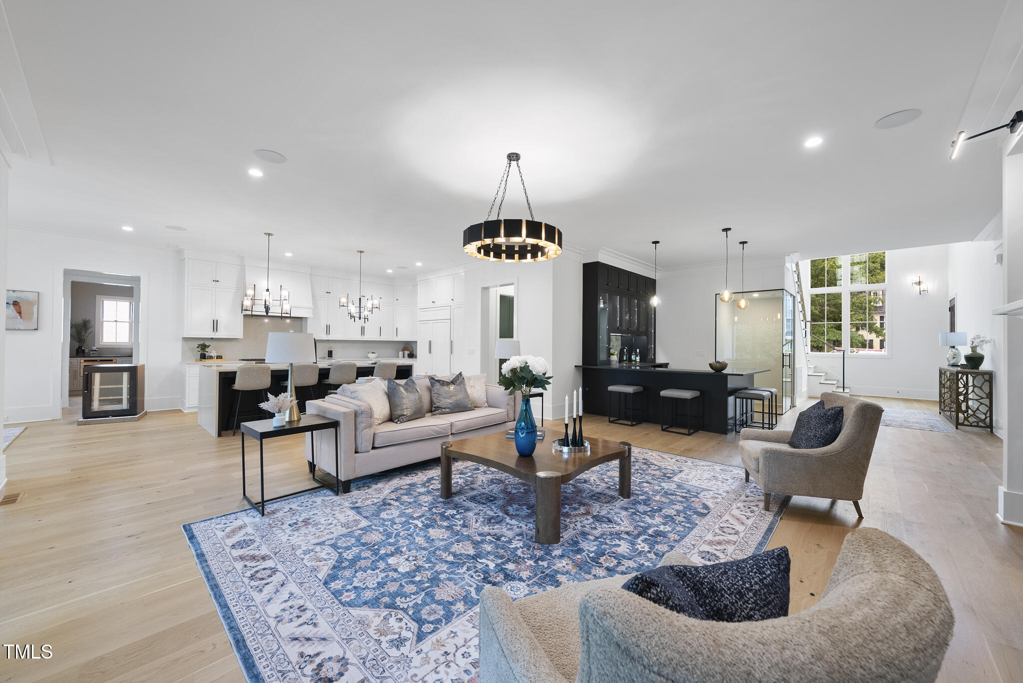 3407 Churchill Road Raleigh, NC 27607 - Photo 11 of 44 a living room with furniture and a chandelier