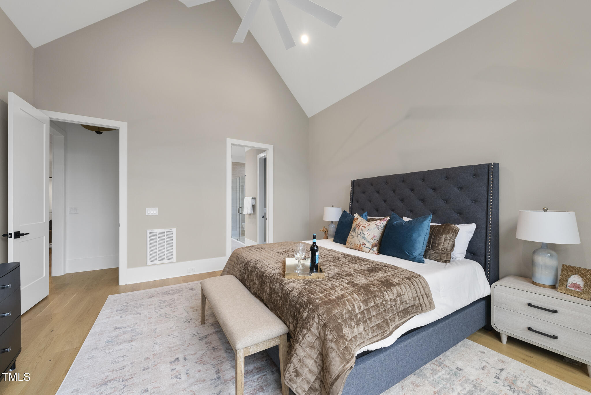 3407 Churchill Road Raleigh, NC 27607 - Photo 16 of 44 a bedroom with a bed and a lamp on dresser