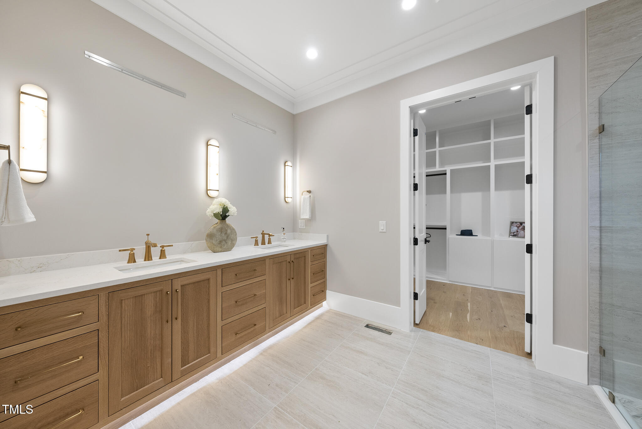 3407 Churchill Road Raleigh, NC 27607 - Photo 17 of 44 a spacious bathroom with a shower sink and mirror