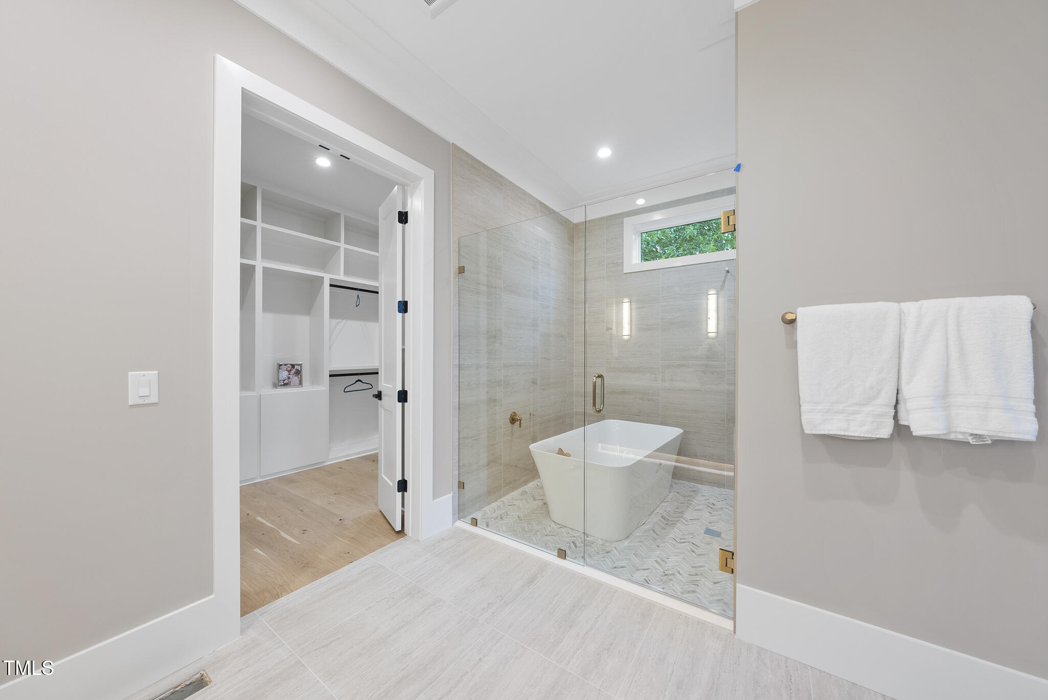 3407 Churchill Road Raleigh, NC 27607 - Photo 19 of 44 a spacious bathroom with a bathtub and shower
