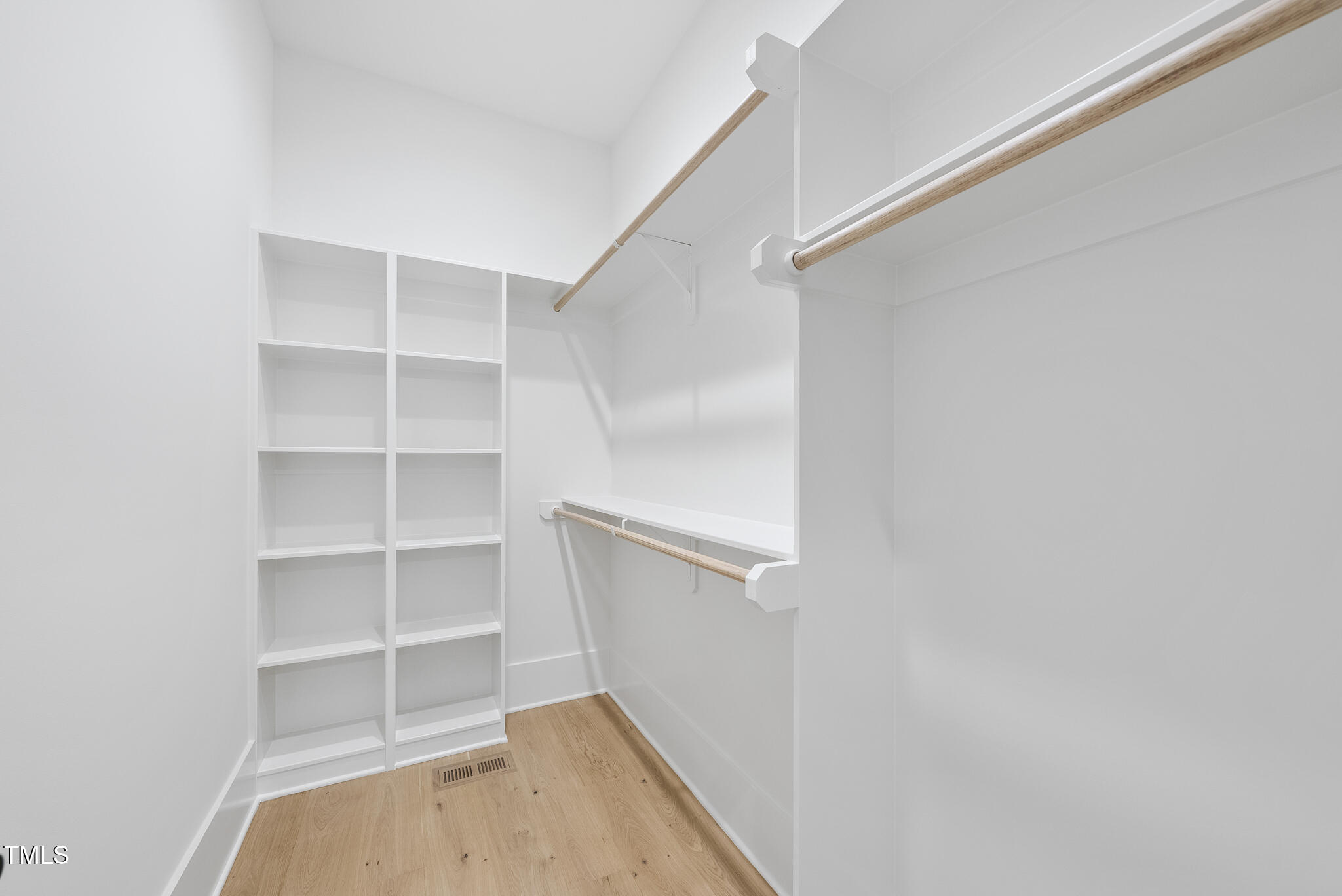 3407 Churchill Road Raleigh, NC 27607 - Photo 23 of 44 a view of walk in closet with empty racks
