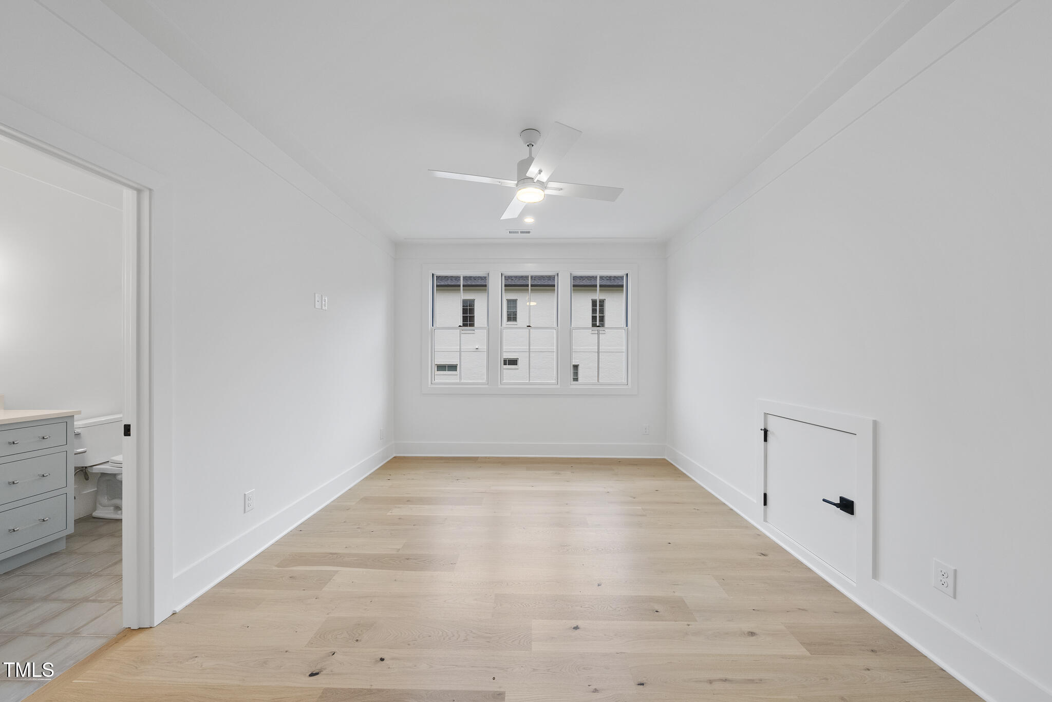 3407 Churchill Road Raleigh, NC 27607 - Photo 28 of 44 wooden floor in an empty room with a window