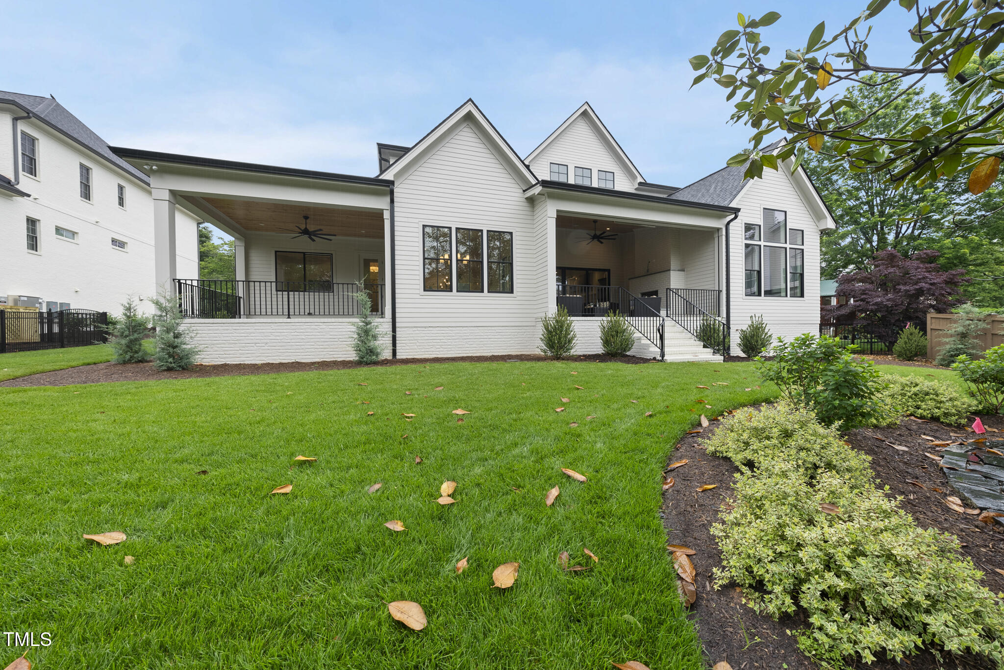 3407 Churchill Road Raleigh, NC 27607 - Photo 40 of 44 a front view of a house with a garden and yard