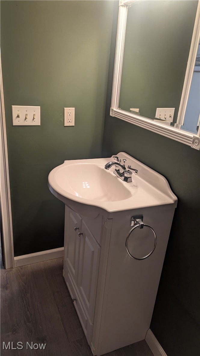290 Leatherman Road Wadsworth, OH 44281 - Photo 29 of 43 Bathroom featuring vanity and wood finished floors