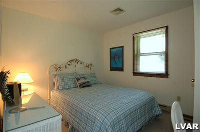 6347 Durham Road Riegelsville, PA 18077 - Photo 8 of 10 a bedroom with a bed and a window
