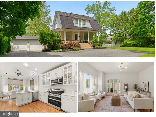 a front view of a house with a yard and a street