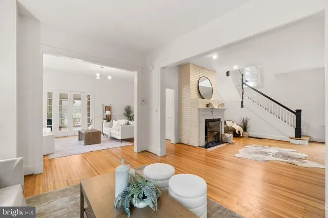a living room with furniture or couch and a chandelier