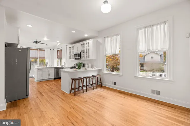 a view of an entryway with wooden floor