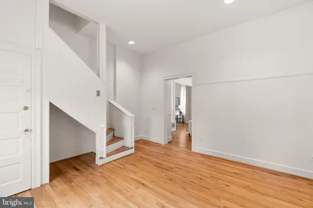 a kitchen with a refrigerator sink and cabinets