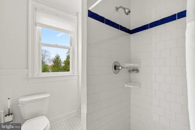 a view of a patio with table and chairs with wooden floor and fence