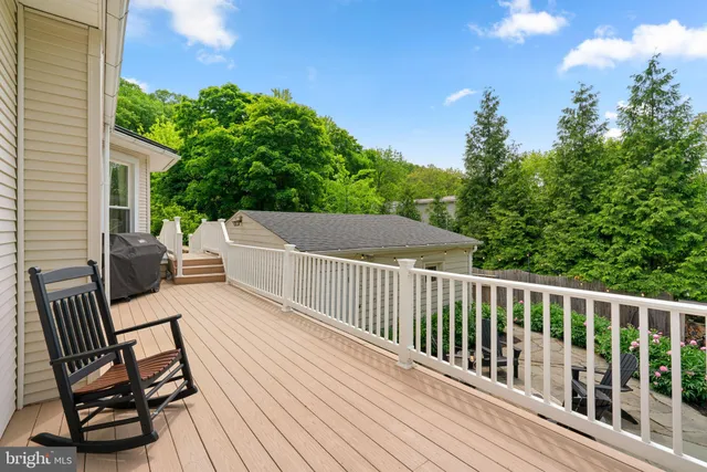a front view of a house with a garden and plants