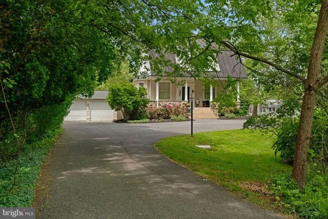 a view of a chair and table in the garden