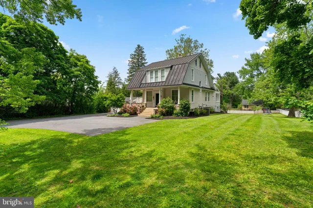 a view of a park with trees and grass