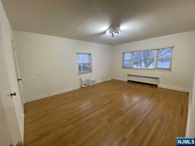 1374 Anderson Avenue, Unit 1 Fort Lee, NJ 07024 - Photo 2 of 5 wooden floor in an empty room