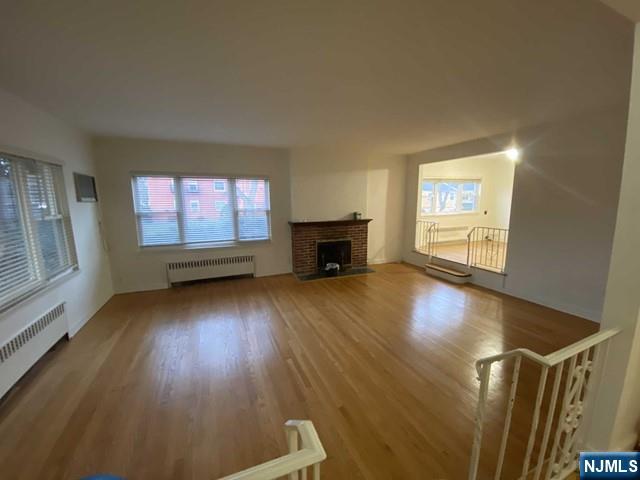 1374 Anderson Avenue, Unit 1 Fort Lee, NJ 07024 - Photo 4 of 5 wooden floor in an empty room with a window