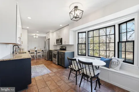 a view of a workspace with bookshelf