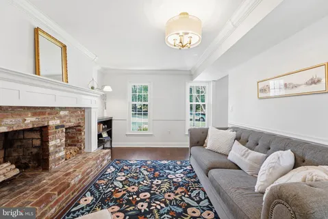 a bathroom with a sink a mirror a toilet and a shower