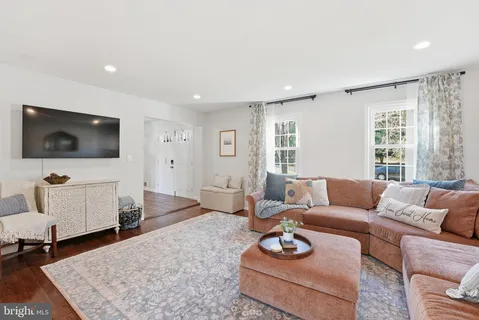 a living room with furniture and a rug