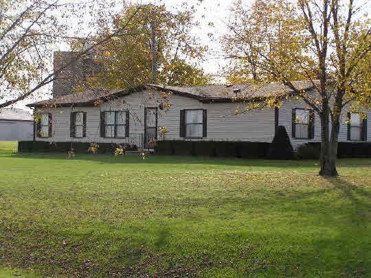 7514 Perryville Road Monroe Center, IL 61052 - Photo 1 of 1 a view of a house with a garden