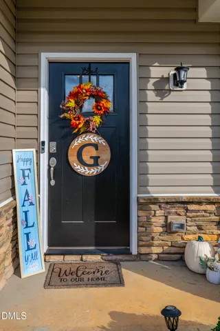 a view of living room with furniture and a rug