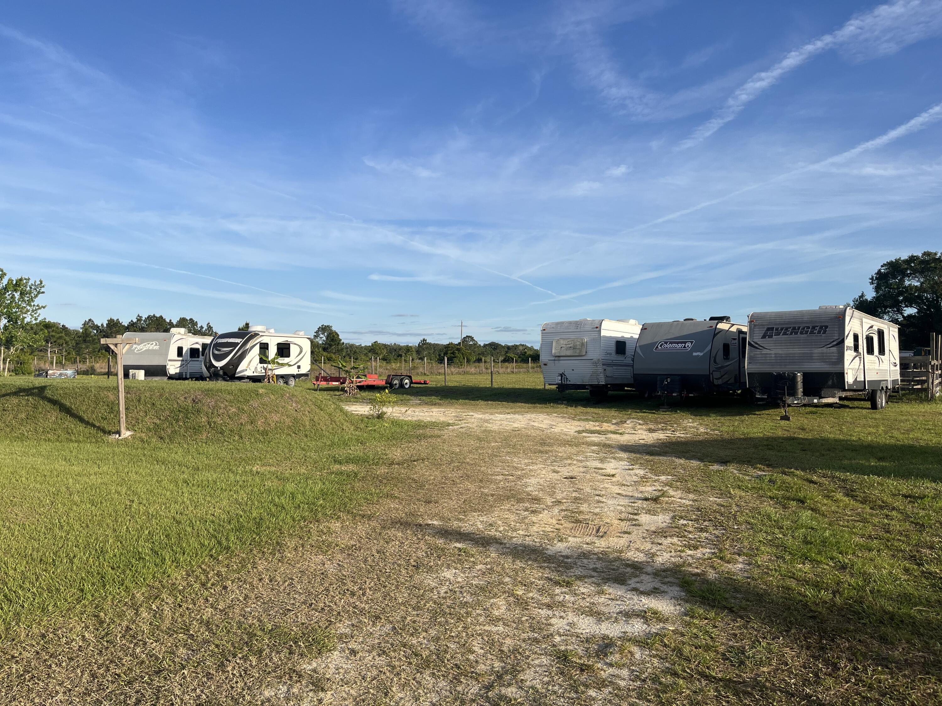 15628 Northwest 310th Street Okeechobee, FL 34972 - Photo 33 of 38 a view of a lake with a big yard