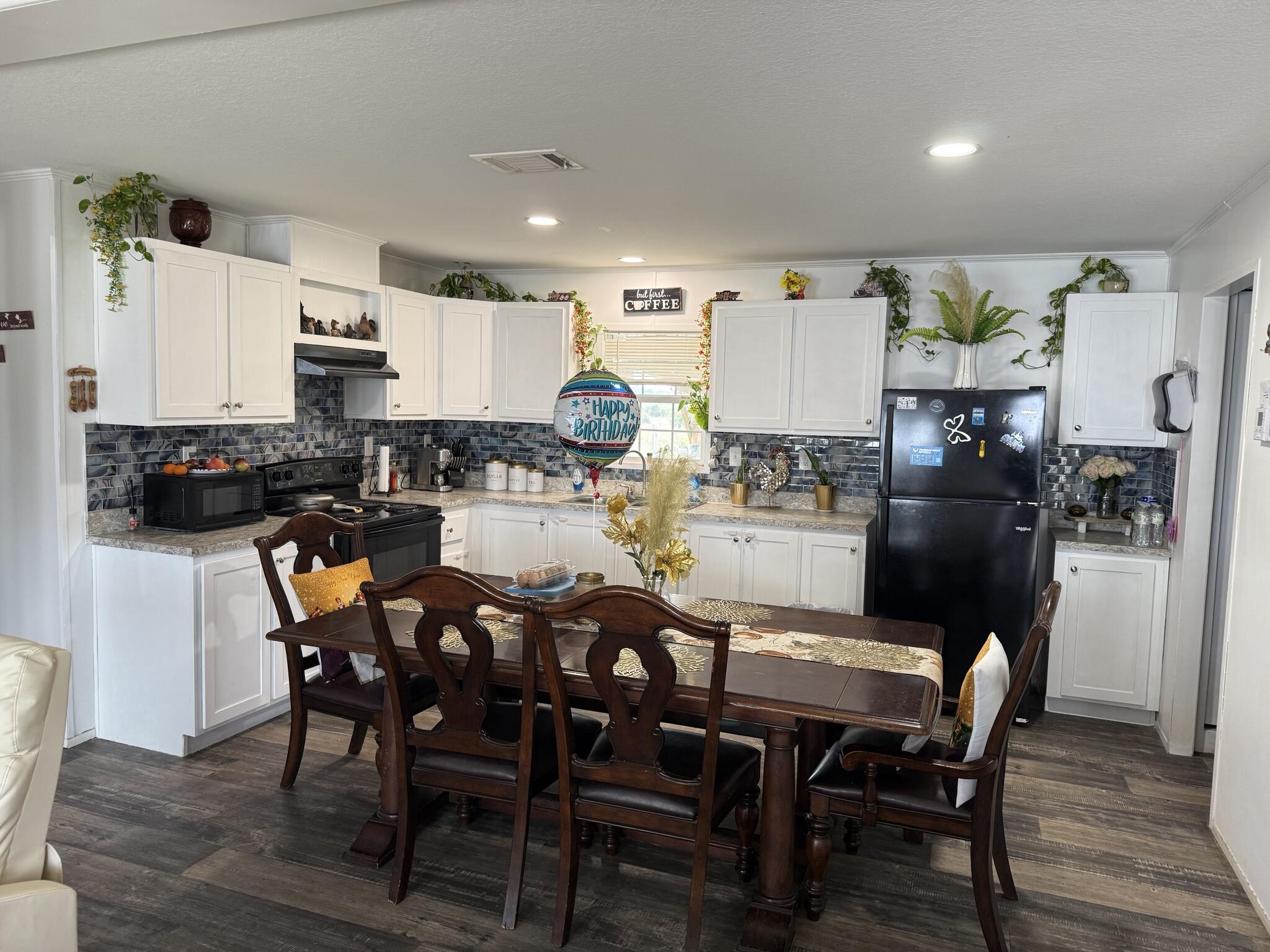 15628 Northwest 310th Street Okeechobee, FL 34972 - Photo 4 of 38 a view of a dining room with furniture