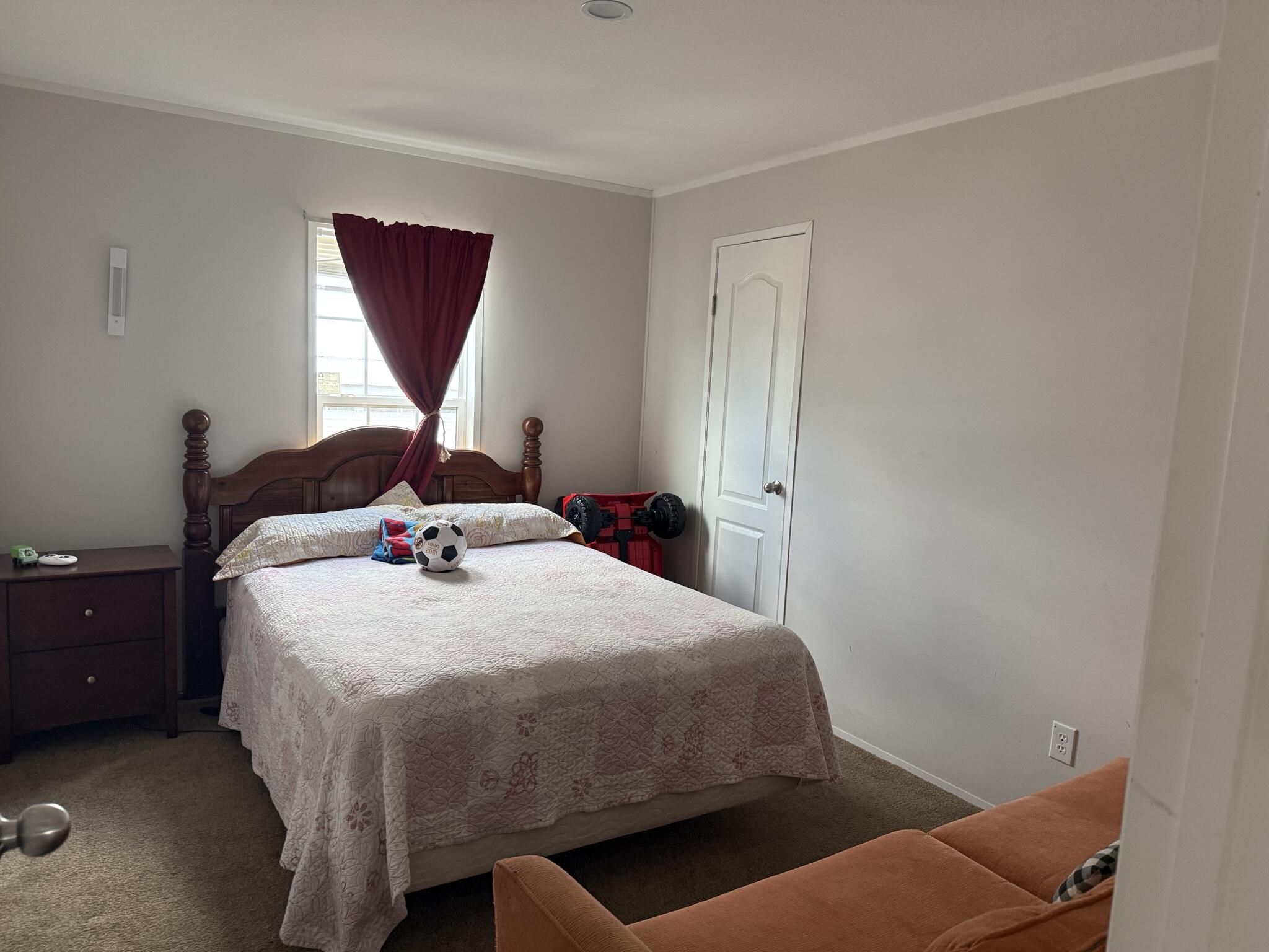 15628 Northwest 310th Street Okeechobee, FL 34972 - Photo 8 of 38 a bedroom with a bed and a window