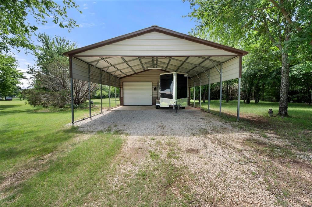 2101 Ridge View Drive Cleburne, TX 76033 - Photo 8 of 31 Detached metal carport structure with an integrated single-bay garage