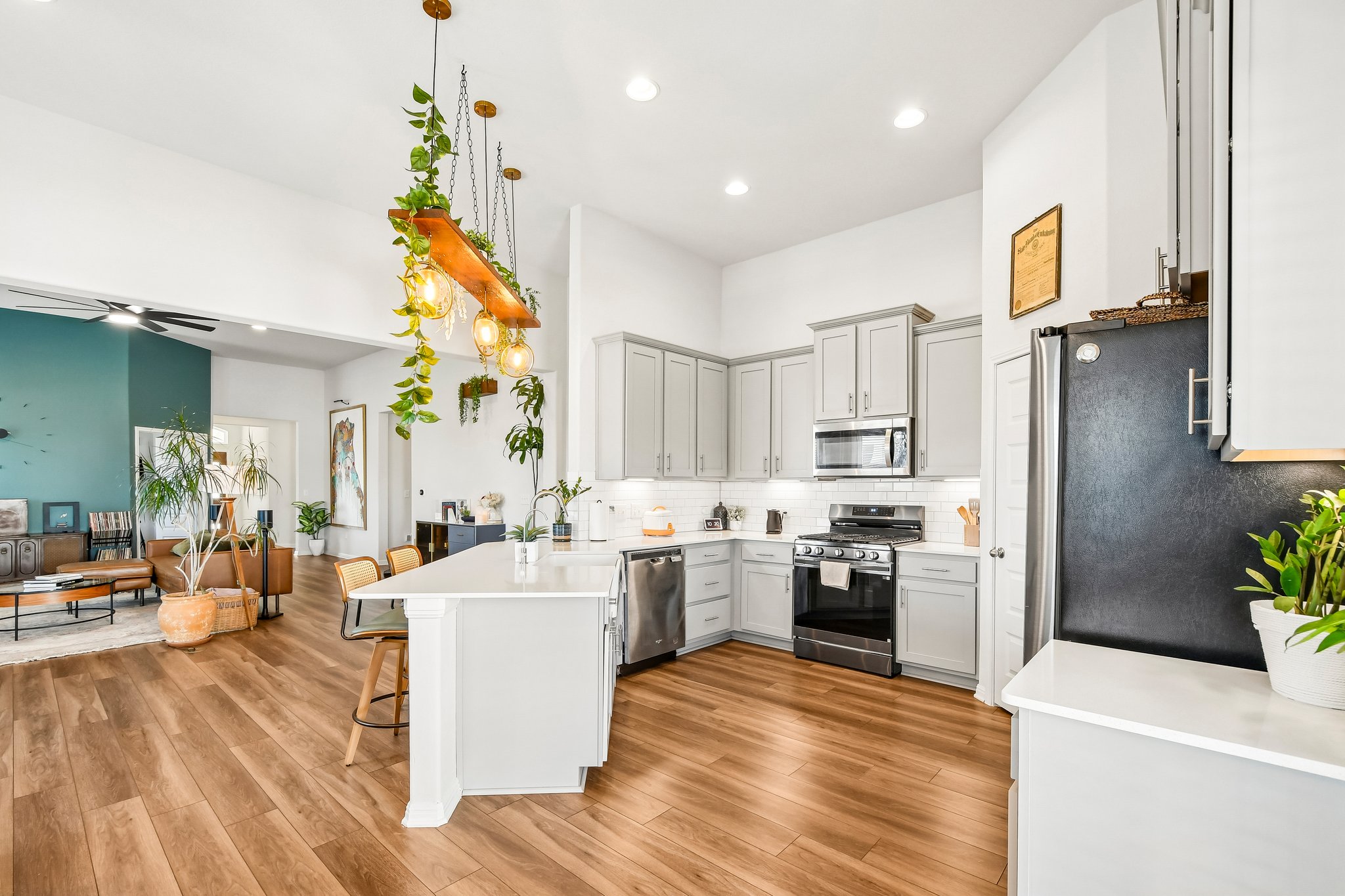 10700 Sentinel Drive Austin, TX 78747 - Photo 13 of 27 Quartz counters, SS appliances, and a kitchen that stays right in the conversation.