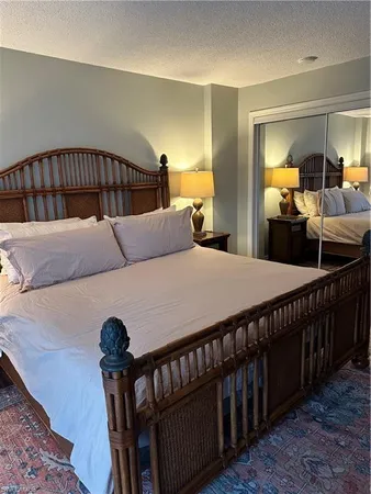 a bedroom with furniture and a wooden floor