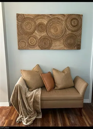 a white couch sitting next to a white walls