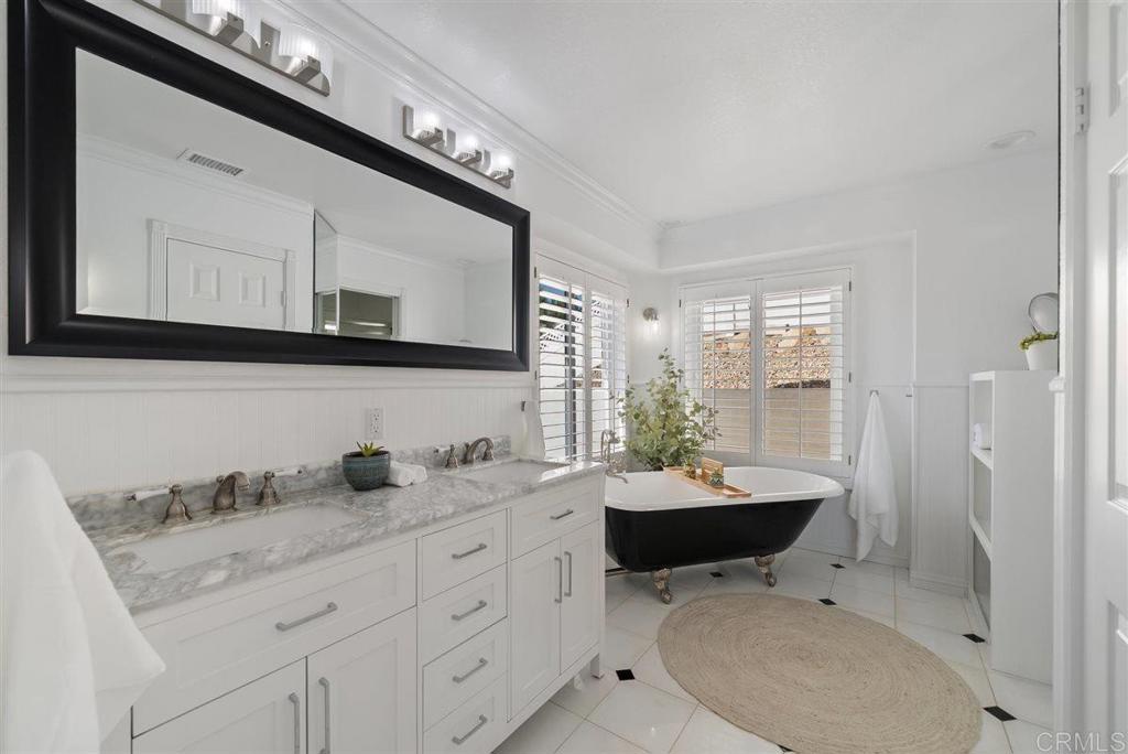 16416 Wikiup Road Ramona, CA 92065 - Photo 18 of 26 a bathroom with a toilet a sink and mirror
