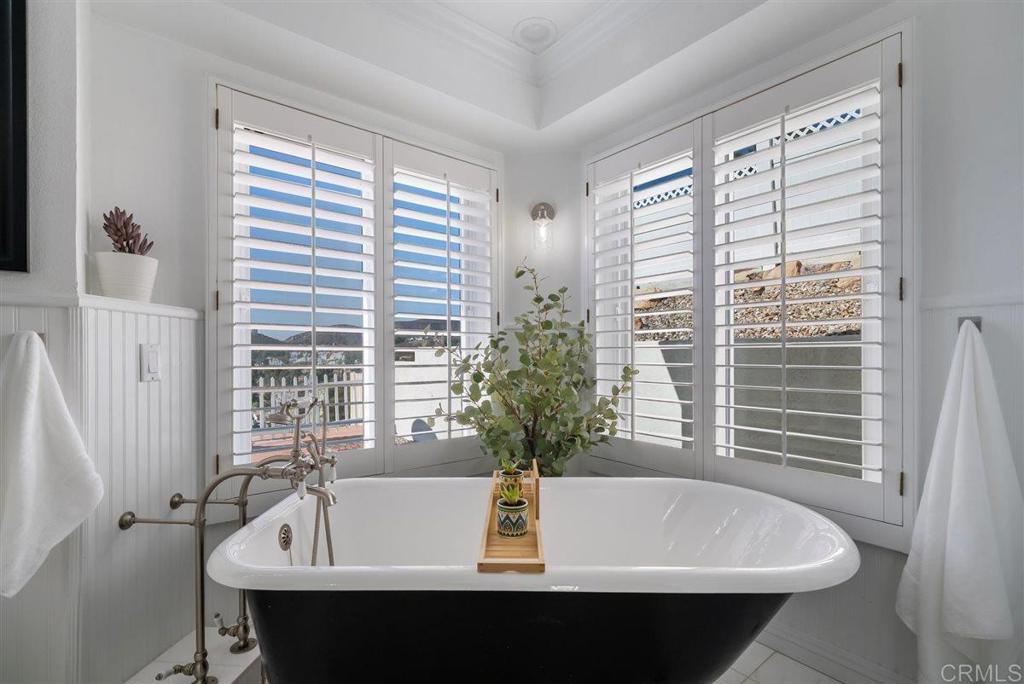 16416 Wikiup Road Ramona, CA 92065 - Photo 19 of 26 a white bath tub sitting in a bathroom next to a window