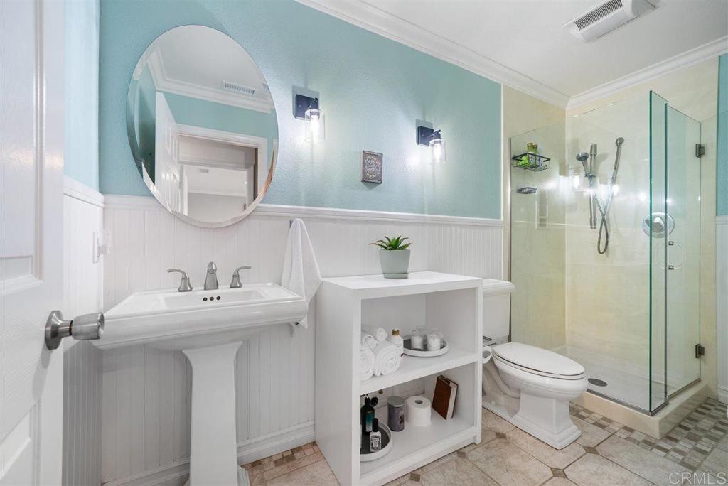 16416 Wikiup Road Ramona, CA 92065 - Photo 23 of 26 a bathroom with a bathtub sink mirror and toilet