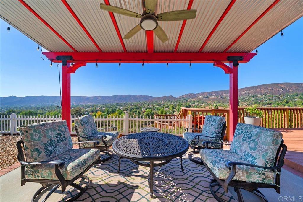 16416 Wikiup Road Ramona, CA 92065 - Photo 3 of 26 a view of a balcony with furniture and a floor to ceiling window