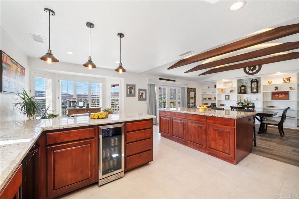16416 Wikiup Road Ramona, CA 92065 - Photo 7 of 26 a kitchen with stainless steel appliances granite countertop a sink and wooden cabinets