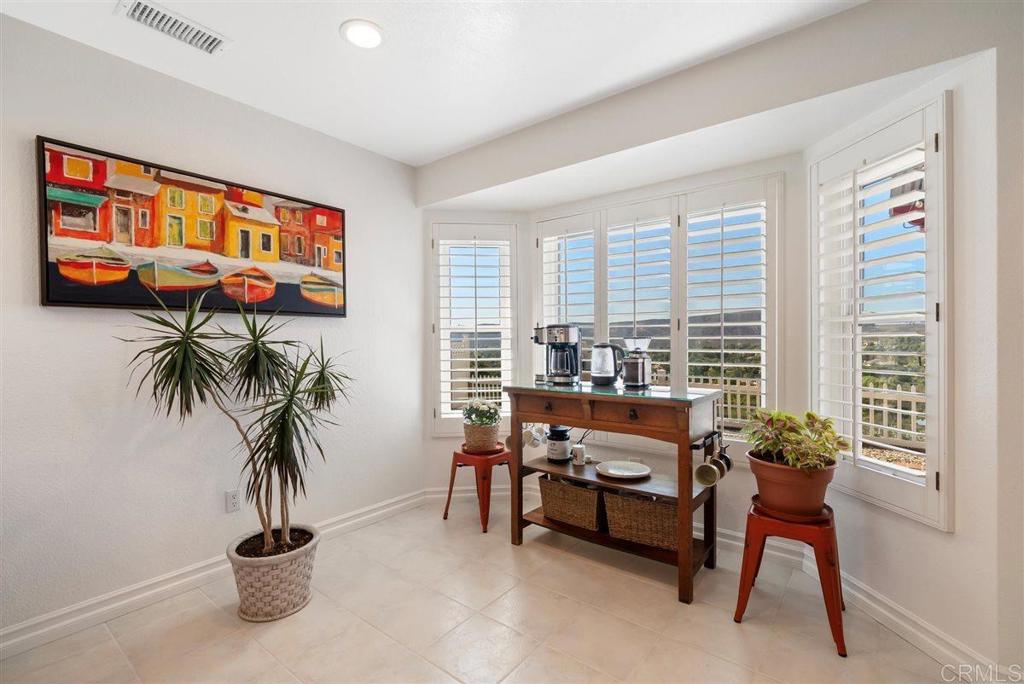 16416 Wikiup Road Ramona, CA 92065 - Photo 9 of 26 a living room with furniture potted plant and a large window