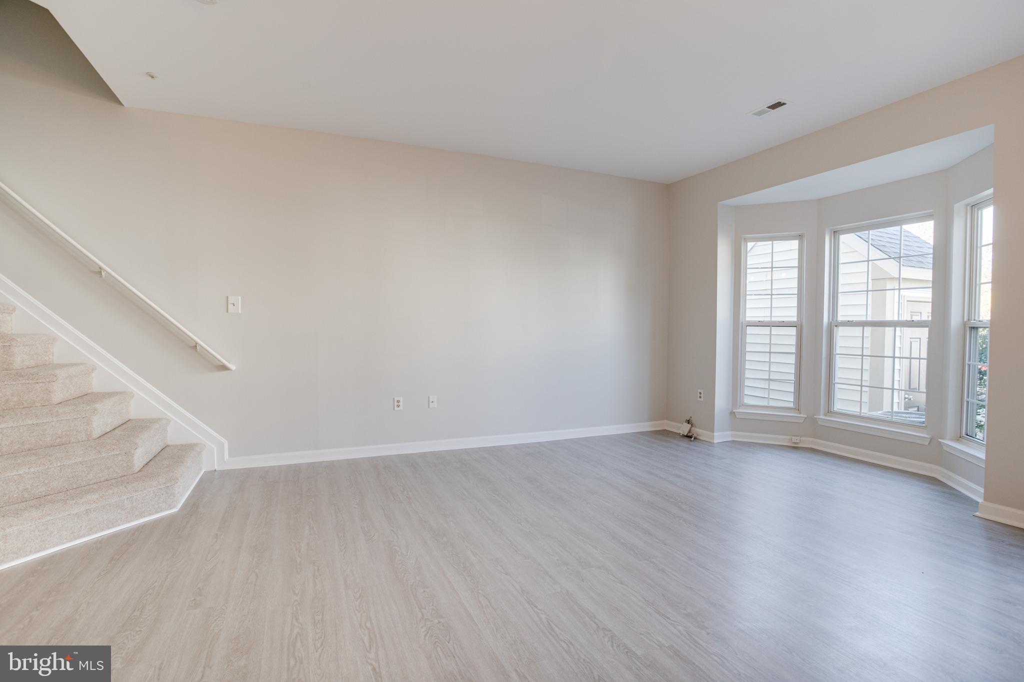 329 Assembly Point Court Odenton, MD 21113 - Photo 3 of 22 Spacious Living Room with NEW vinyl flooring!