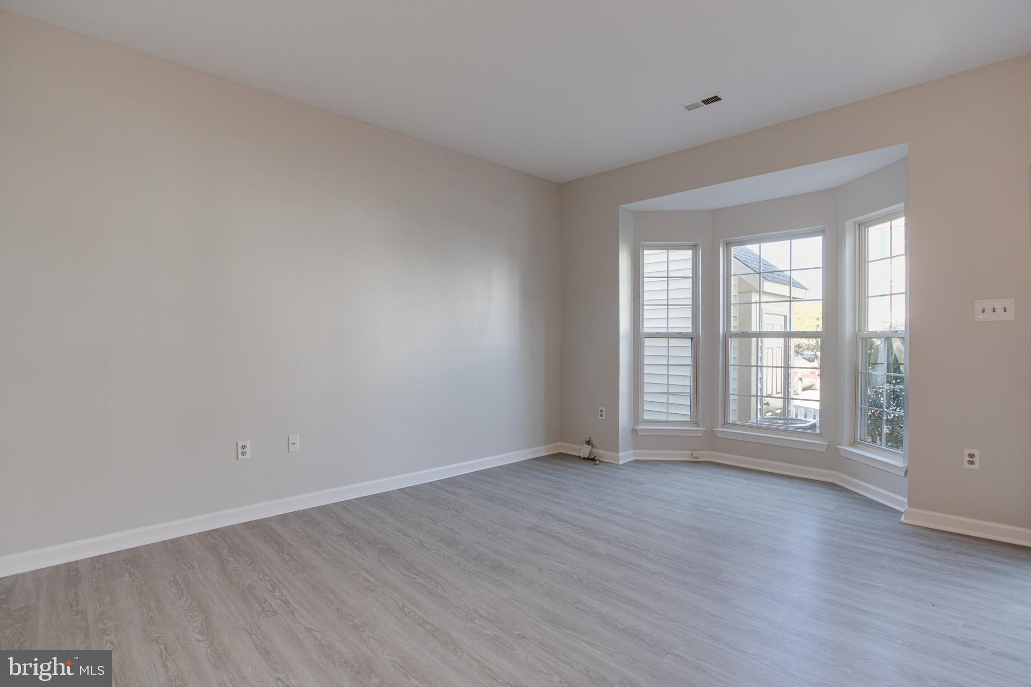 329 Assembly Point Court Odenton, MD 21113 - Photo 4 of 22 Spacious Living Room with NEW vinyl flooring!