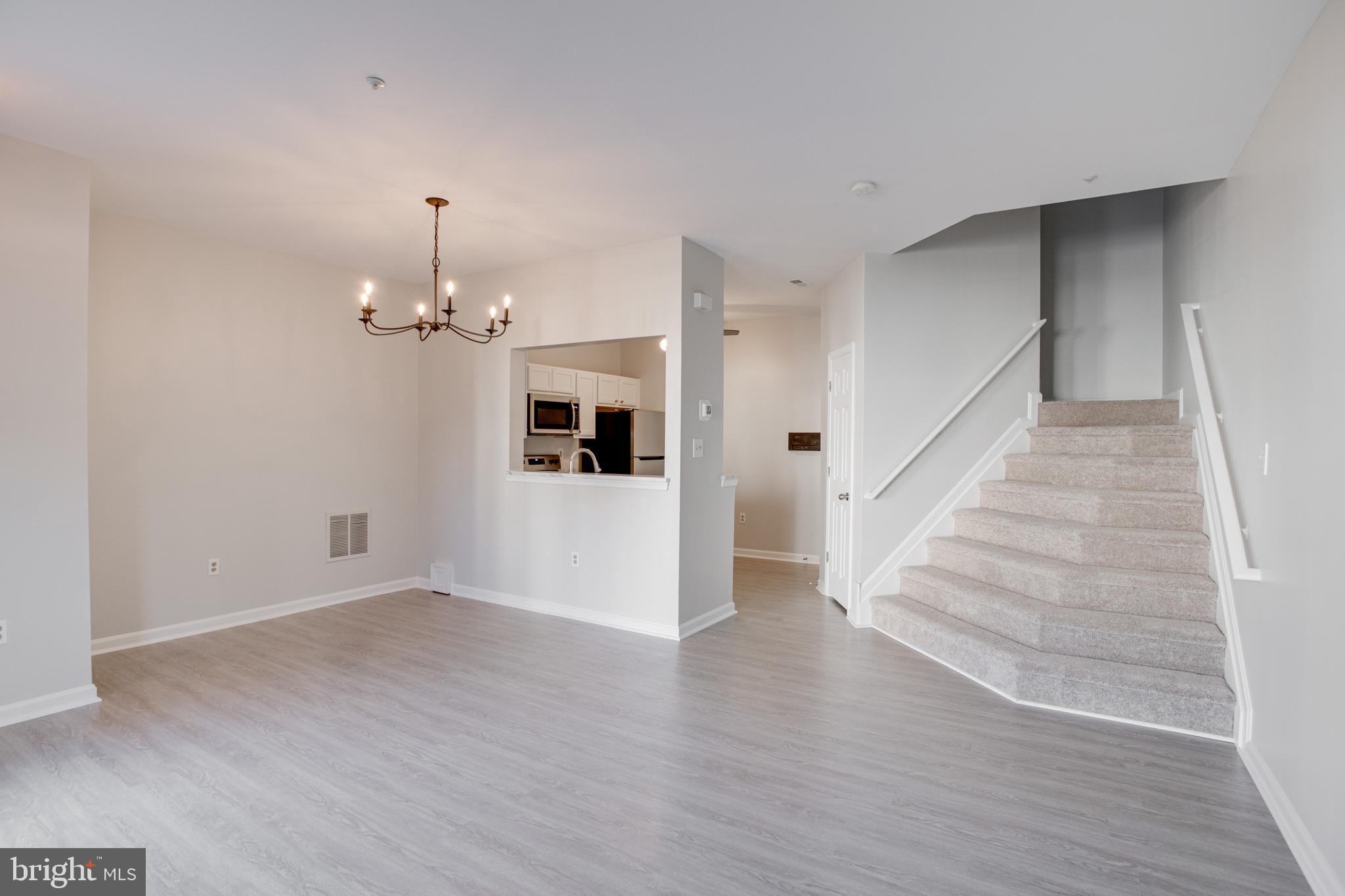 329 Assembly Point Court Odenton, MD 21113 - Photo 5 of 22 Spacious Living Room with NEW vinyl flooring!