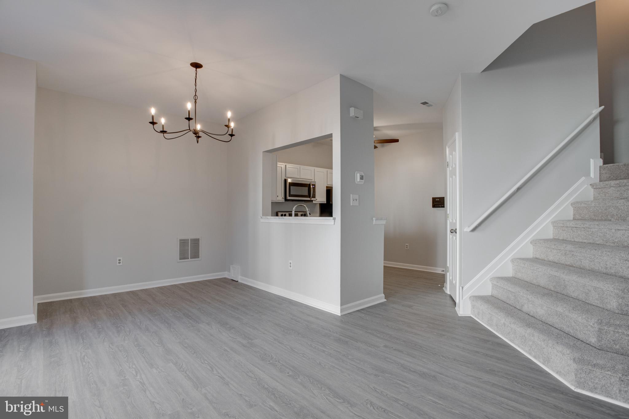 329 Assembly Point Court Odenton, MD 21113 - Photo 6 of 22 Spacious Living Room with NEW vinyl flooring!