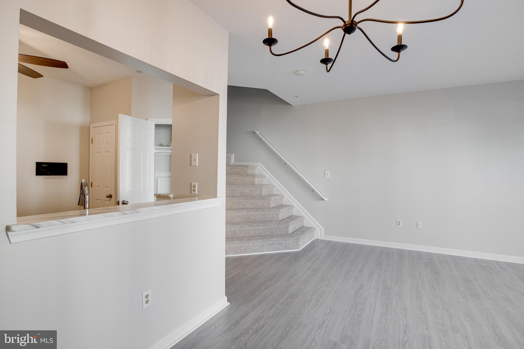 329 Assembly Point Court Odenton, MD 21113 - Photo 7 of 22 Spacious Living Room with NEW vinyl flooring!