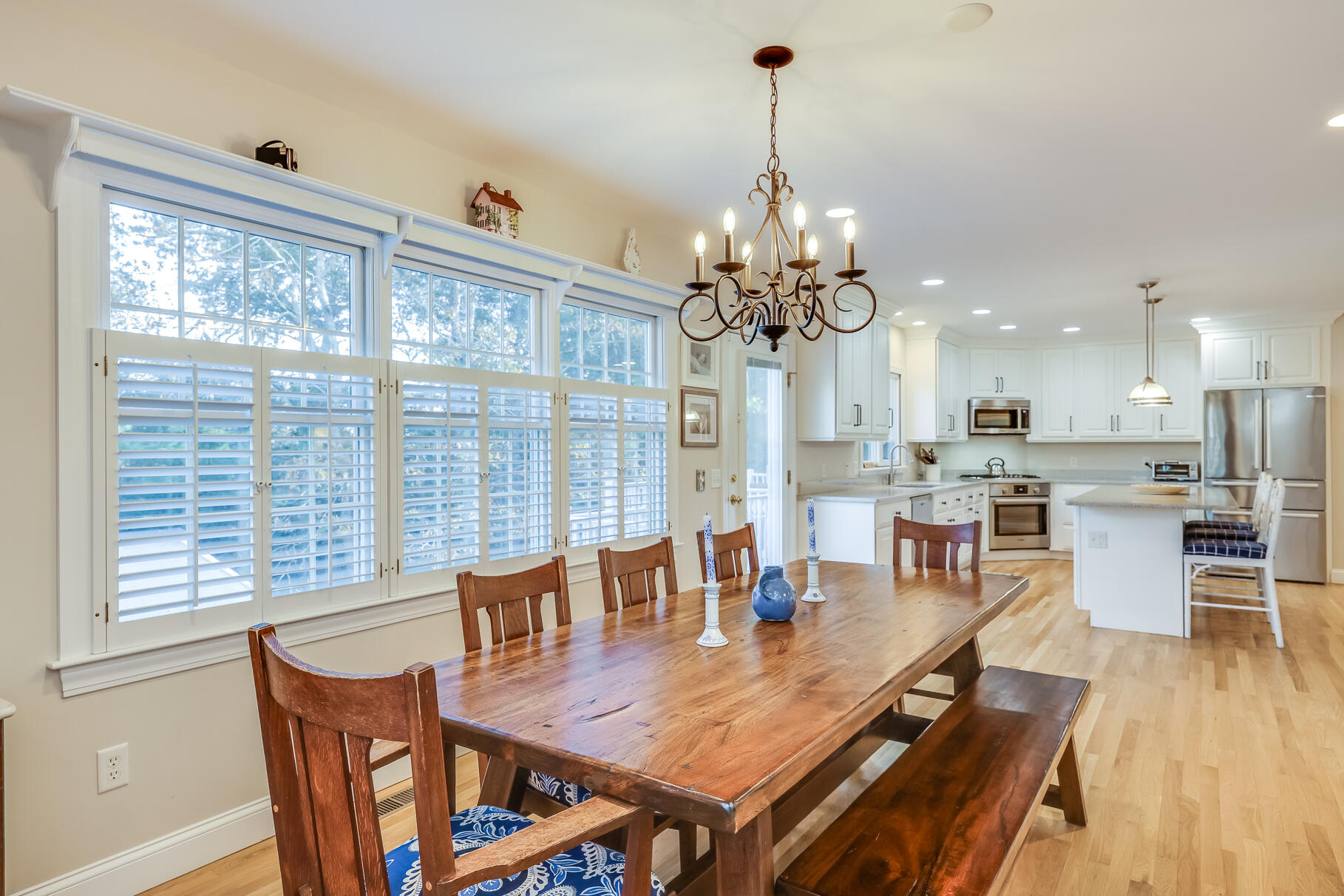 9 Ridgewood Road Orleans, MA 02653 - Photo 19 of 81 a view of a dining room with furniture a chandelier and wooden floor