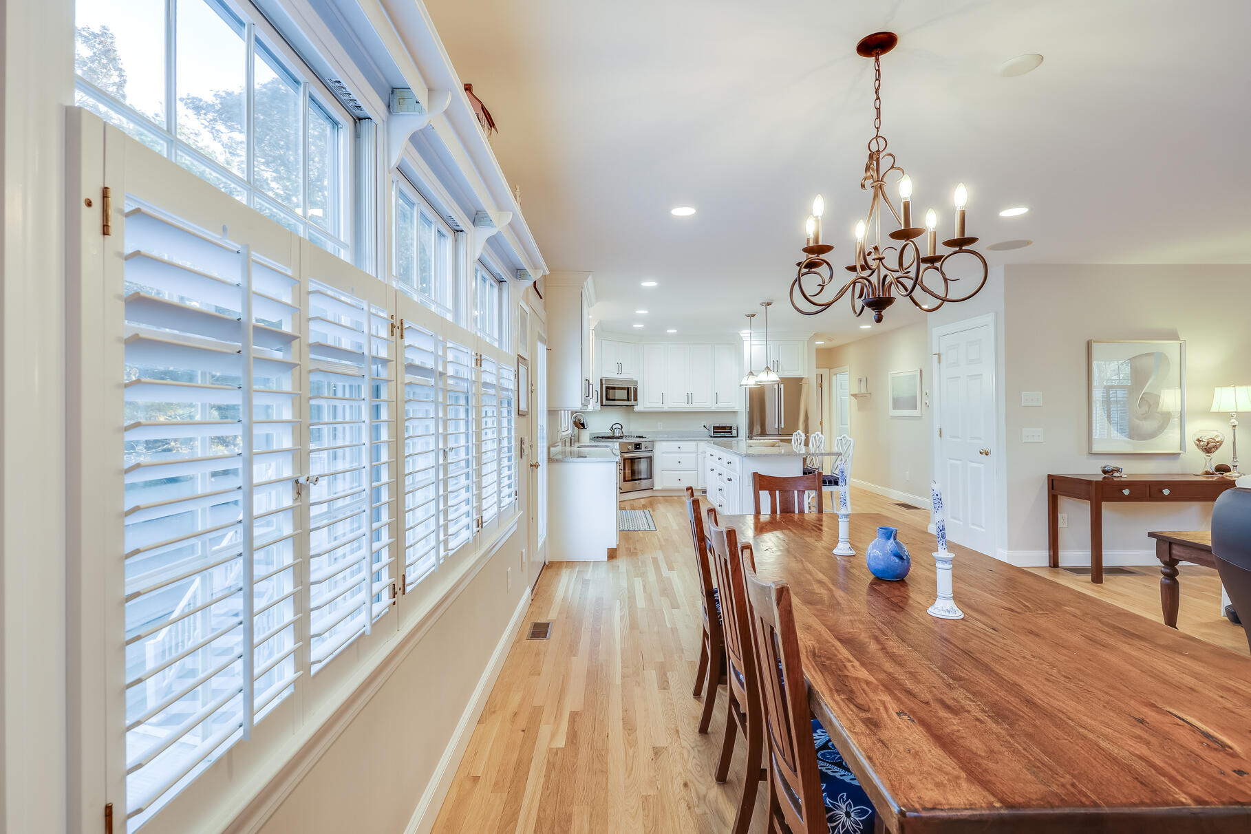 9 Ridgewood Road Orleans, MA 02653 - Photo 20 of 81 a view of a dining room and livingroom with furniture wooden floor a chandelier